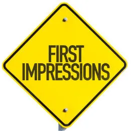A yellow road sign that reads First impressions